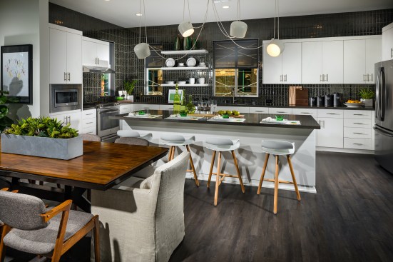 Large kitchen islands, like this one in Trumark’s Perch townhome community in Dublin, California, can also serve as a dining area, work-from-home space, or a dedicated place for homework.