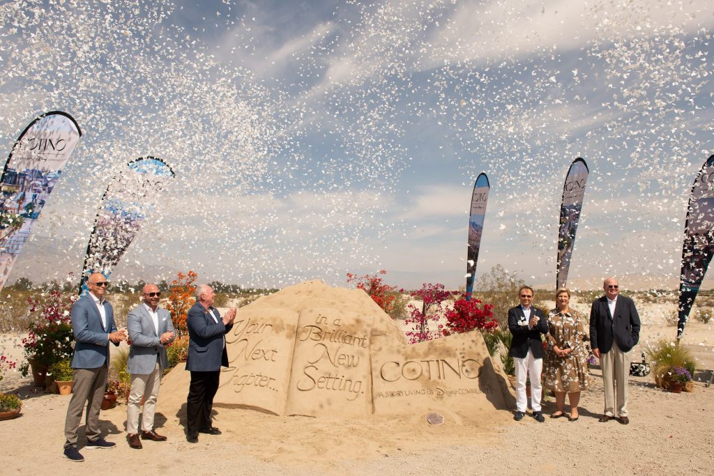 Thomas Mazloum, president of Disney Signature Experiences, places a ceremonial medallion in the ground to celebrate work starting on Cotino, a Storyliving by Disney community.