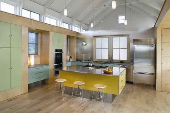 The clean-lined components of this kitchen great room look as if they were slid into an older, more traditional building shell, but the entire house is new.
