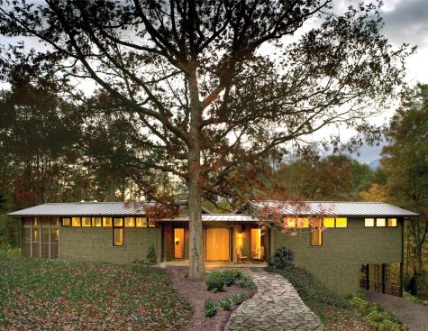 Carefully placed on a sloped site and situated amid trees protected during construction, the Celo Residence integrates well with its surroundings. A rainwater catchment system feeds landscape irrigation.