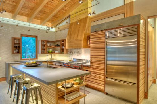 The kitchen cabinet boxes are made of locally sourced, urea-formaldehyde free plywood and all doors, drawer heads, and shelves are made of reclaimed materials that builder Josh Wynne salvaged from a local sawmill.