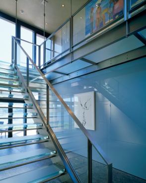 CUSTOM HOME  2010 CHDA  Lagoon Pond Pavilion, Vineyard Haven, Mass.  Merit Award / Custom Detail    A balcony and three bedrooms on the upper level overlook the water and are reached via the house's glass stairs.