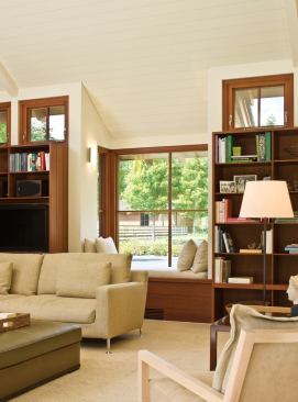 Focused decidedly toward the south, the great room's north-facing windows are high and small. The exception is a large bay window that views the entry court.