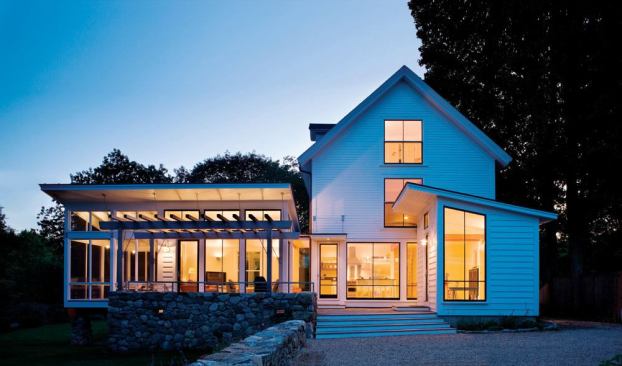 Two shed-roof additions are both distinct from and in harmony with the original house.