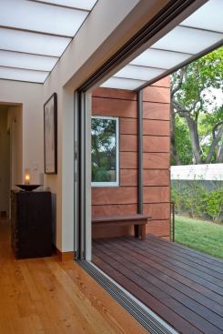 Skylights bring in diffused daylight, while the Norwood multi--panel sliding door provides an easy flow to the covered deck.