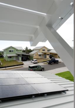 Solar panels clip easily onto the reflective standing-seam metal roof.