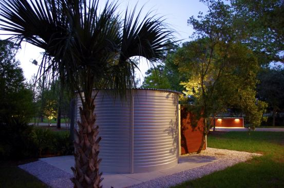 Power Haus has two under-slab waste piping systems: one for greywater from the sinks, laundry, and showers and ones for blackwater from toilet waste. The greywater runs into a Brac 250-gallon recovery system and is filtered for re-use as toilet water. Outside, all of the roof’s runoff is captured in 8-inch Galvalume gutters across the eaves and gravity-fed underground to a remote 6,000-gallon cistern (shown) where it is used to fill horse-watering troughs and for irrigation.