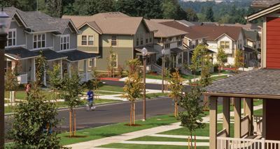 Now a model for low-impact design, the Hope VI project incorporates a system of bio-retention swales that filter 91 percent of stormwater on site, restore the natural flow of the on-site T-Street Gulch, and reduce pollution in Swan Creek. Existing road right-of-ways and building pads were reused to support a diverse mix of housing types, and all streets now enjoy direct connections to shared green spaces and pocket parks. “When you have such a large site, it's an opportunity to make an impact in the region,” says Janet Rice, director of housing development for the Tacoma Housing Authority.