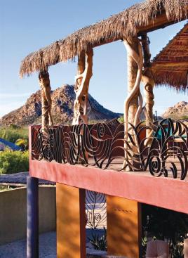 Transparent hurricane fabric protects the houses glass openings and solar panels.