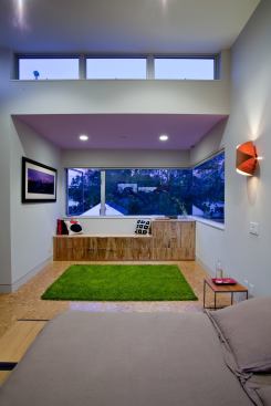 Modern styling in the master bedroom includes high-efficiency windows and clerestory windows, and high-efficacy lighting fixtures. Phase-changing drywall throughout the home enhances comfort and energy efficiency.