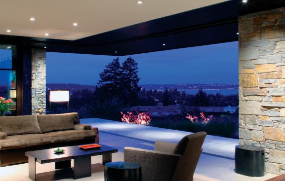 The living room opens onto a view of Lake Washington and the city of Seattle.