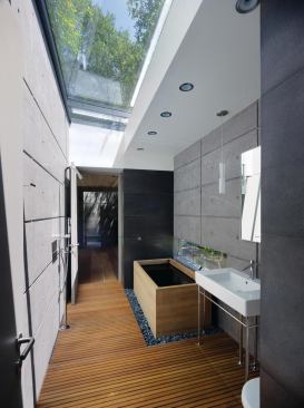 A skylit full bath connects two of the teahouses.