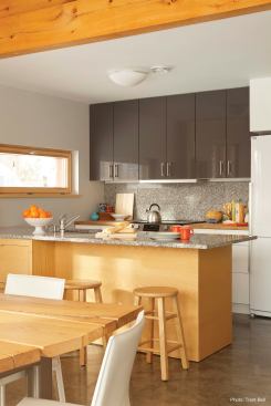 The kitchen features locally quarried Freshwater Pearl granite and oak butcher block countertops and formaldehyde-free IKEA cabinets.