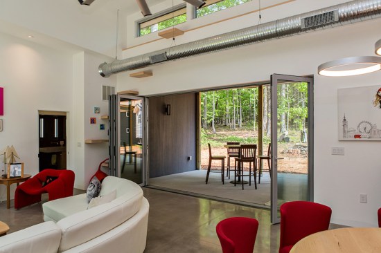 A wall of folding glass doors opens the core of the house to the back porch.