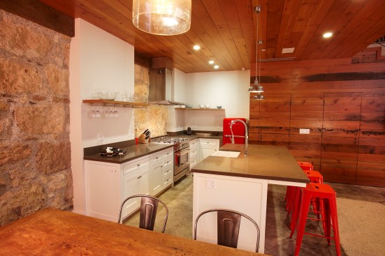 The barn's old stone walls are 3 feet thick. The reclaimed Douglas planks used for the walls and ceiling look especially warm and luxurious next to the old stone wall. 