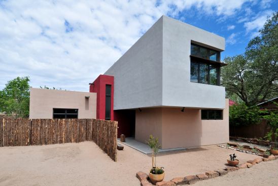 The clients were moving back to the States to retire, after years of living and working in Asia, and they’d amassed a large collection of folk art that had to be shipped back home. Shipping containers and houses made from them helped inspire the exterior design.