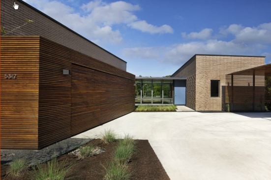 Ipe’ mediates between the brick façade and the outside plantings of this modernist house, located in an Austin subdivision. Location: Austin, Texas; Architect: Alterstudio Architects