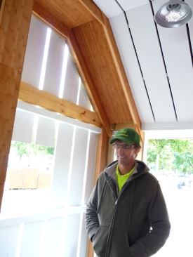 Mark Taylor, an assistant architecture professor from the University of Illinois at Urbana-Champaign, tells incoming visitors about the Gable House’s use of laminated bamboo framing.