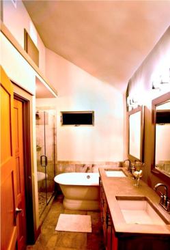 Transom windows bring in light to the master bathroom but maintains privacy.