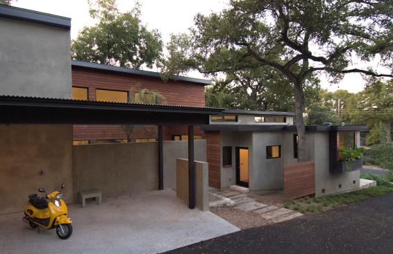 The Post Oak Retreat by architect Camille Urban Jobe is a 2,250-square-foot SIP house that was built on a tight lot in an established Austin, Texas, neighborhood. It features a stucco exterior, a Brazilian hardwood rainscreen, and a steel plate rainscreen.