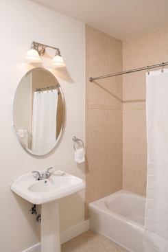 Baths are airy and bright but modestly detailed.