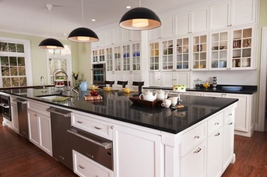 It's important to balance classic design and a green sensibility, says Robin Wilson. Here in the Kennedy Residence, she uses white maple cabinets and ECO by Cosentino countertop.