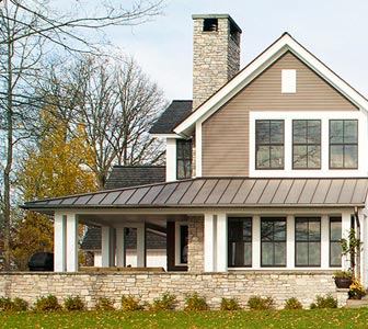 This Minnesota lake home’s exterior offers an update of traditional farm house forms. However, once inside, the floor plan opens wide to allow for sweeping lake views, breezes, and modern living. Oversized double-hung windows help to bridge the gap between old and new styles, mimicking large picture windows while maintaining the exterior’s historic aesthetic. Project: North Woods Lake Home, Grand Rapids, Minn.; Architect: Albertsson Hansen Architecture, Minneapolis