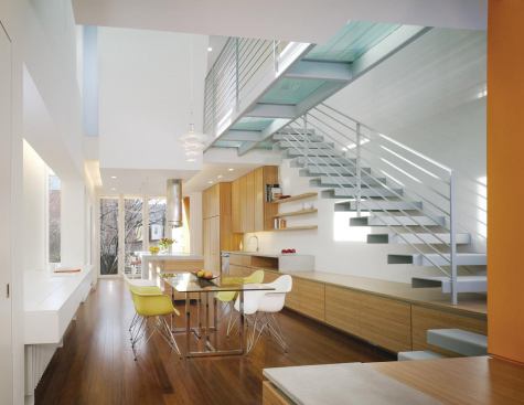 Remodeling Magazine  October 2010  Best of the Year: Urban Renewal    The owners of this end row house in Washington, D.C., wanted a more open space that felt like an art gallery. Architects John Burke, Hans Kuhn, and Chris DeHenzel came up with the idea of a light tunnel to bring an airy feel to the center of the house. The remodeled main floor of the home has the quality of a plaza or outdoor space.