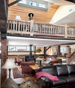 In the living room, a wood stove serves as the hearth. It helps keep the living room toasty in winter, and the residual heat gets used to provide radiant heat for the floors.