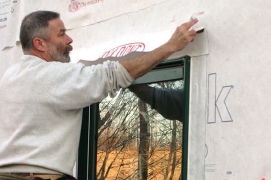 I fold the housewrap flap down over it...