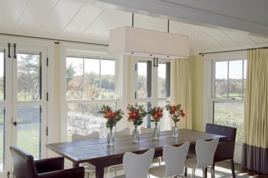 The dining room is a south-facing bay with farmland views.