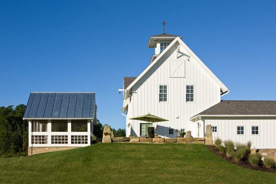 A screened porch also stands alone and is mimics a corn crib.