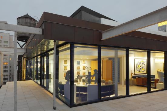 Steel I-beams support the parapet wall.