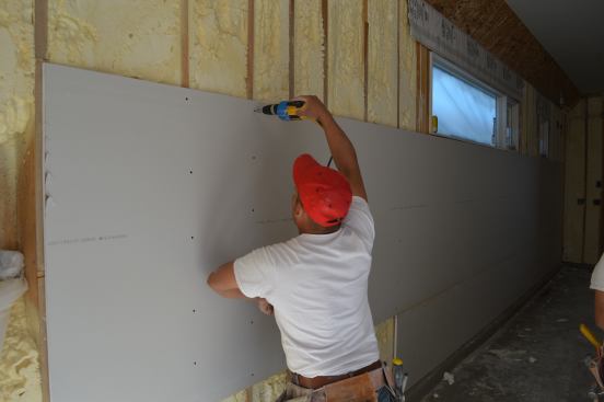 USG’s Firecode 30 5/8-inch drywall was easy to install because it’s 30 percent lighter than standard drywall and easy to cut, says builder Josh Anderson.
