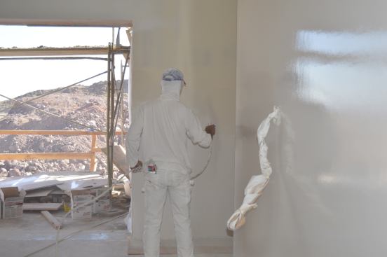 The builder also really liked USG's Sheetrock Tuff-Hide primer/surfacer spray, noting that it saved four weeks' worth of labor. "It’s absolutely amazing,” he says.