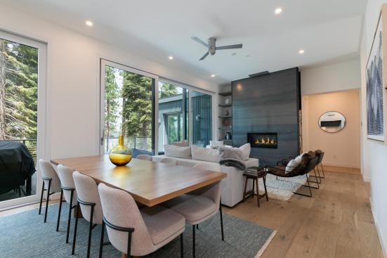 The living room includes a focal electric fireplace, as all Dvele homes are combustion-free.