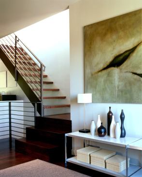 The stair hall adds brightness. Because the lot size was shallower than usual (75 feet instead of the typical 100), adding a rear entry stair wasn’t an option. For this remodel, “Houdini-like feats were required,” says architect Cary Bernstein.