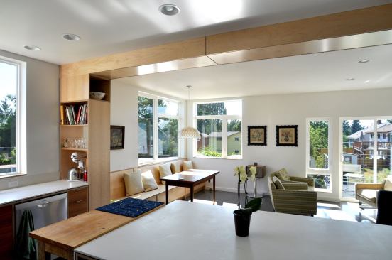 The client wanted the dining/working area to be full of light as it is her primary working area. She also requested that it overlook an old detached garage turned garden shed that is now topped with a vegetated roof.