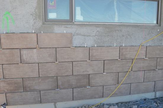 The exterior tiles from Environmental Stoneworks look like stone blocks stacked on top of each other.