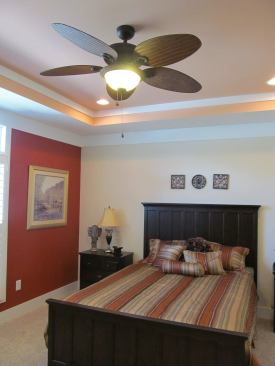 A fully furnished bedroom inside Mod-U-Kraf’s Craftsman-style model. The ceiling fan is one of the options made available to buyers.