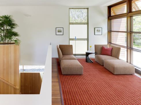 Extra space was carved at the top of the staircase to make room for an intimate sitting area, adding an element of surprise and the perfect place for owners to catch their breath during a hectic day. Project: Palo Alto Residence, Palo Alto, Calif.; Architect: CCS Architecture, San Francisco; Builder: K Welton Inc., Palo Alto