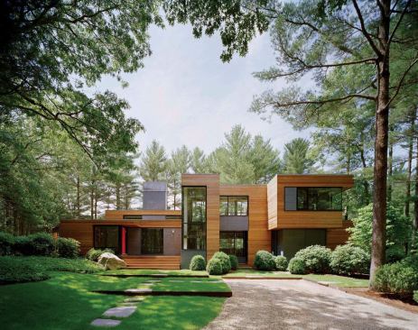 Fresh materials and a firmed up profile turned an aging modernist house into something that might easily pass for a new design.