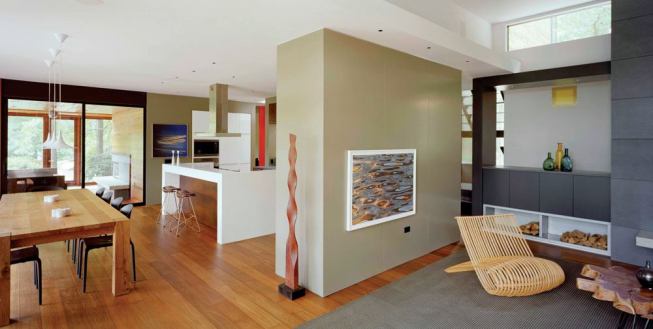 Interior structural elements, treated in contrasting colors, stand out against the loft-like backdrop.