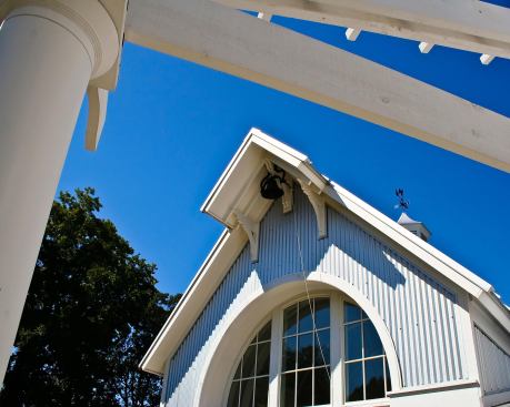 The screened porch pavilion is a bit grander than the rest of the house. It was inspired by the design of carriage houses, which sometimes got added to farmstead properties in times of prosperity.