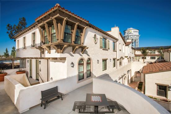 Grand, Residential Project of the Year - Attached Product within a Suburban Setting. Builder: Advent Companies. Architect: Bassenian Lagoni. This transit-oriented development, with homes configured as townhomes-over-flats, is affordable housing that looks like upscale housing.