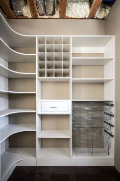 The kitchen pantry is outfitted with shelving systems from Organized Living.