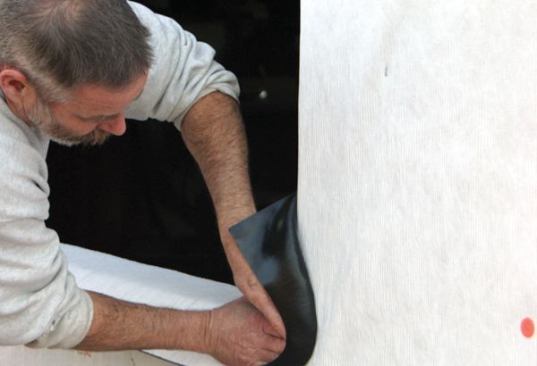 Seamless CornerIn the corners, I carefully stretch the flashing out to create seamless protection.