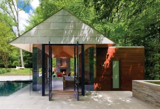 A glass-box entryway blurs the boundaries between indoors and out and helps to set the tone for this artful outbuilding, which serves as a poolhouse and outdoor eating area from which its owners can enjoy nature views year-round. Project: Nevis Pool and Garden Pavilion, Bethesda, Md.; Architect: Robert M. Gurney, Washington, D.C.; Builder: Peterson and Collins, Washington