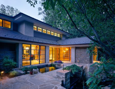 The "away room" as architect Mike Ruegamer likes to call it, juts out into the gardens with only a single connection to the rest of the house.