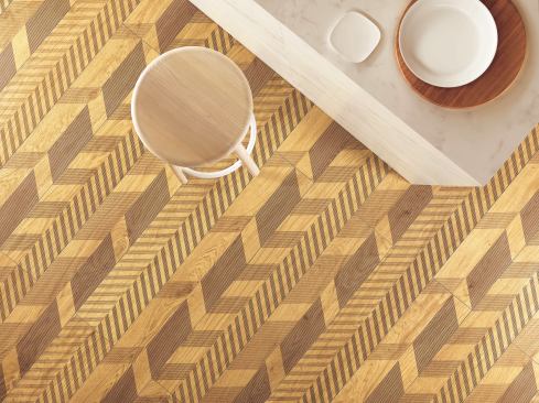 Lea Ceramiche Designed by Diego Grandi, Type-32 is an exercise in creating a new graphic language for flooring design. It overlays detailed wood patterns in cool and warm tones with stylized oblique lines. When laid together, the porcelain tiles create a contemporary interpretation of traditional herringbone floors. The collection uses the firm’s Slimtech long slat sizing, 20 centimeters by 200 centimeters, with a 5mm thickness.